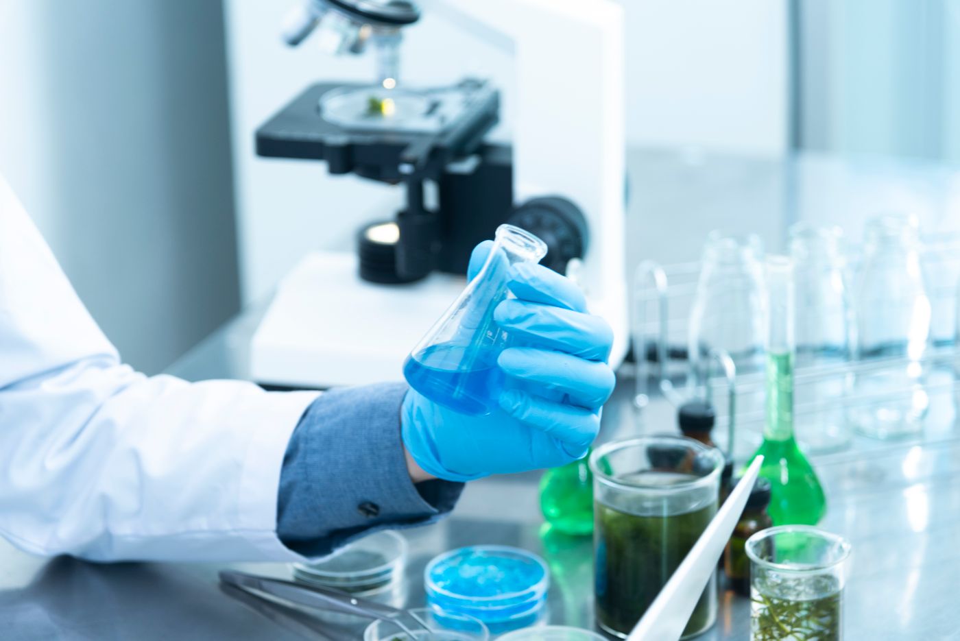 Laboratory technologist analyzing liquid samples in a clinical lab